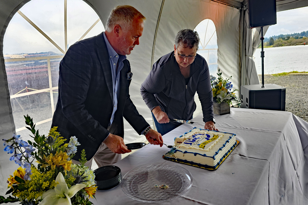 Councilors Cribbins & Kilmer served the cake